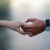 blurred background hands holding hands 715807