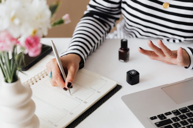 crop woman writing notes while sitting at home 4467858 crop woman writing notes while sitting at home 4467858
