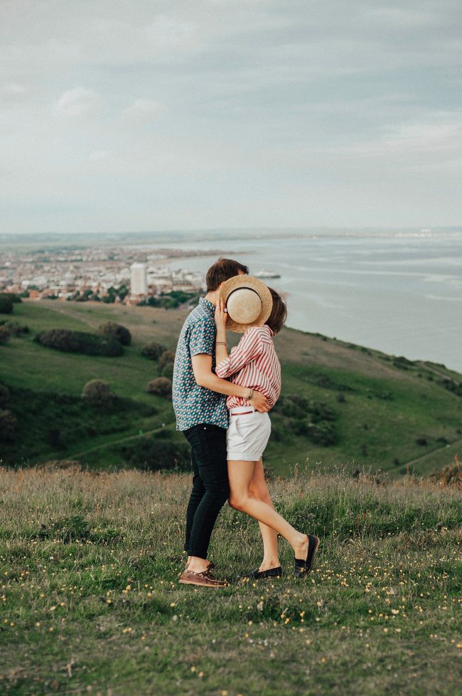 photo of woman and man hugging while standing on grass 1391480 photo of woman and man hugging while standing on grass 1391480